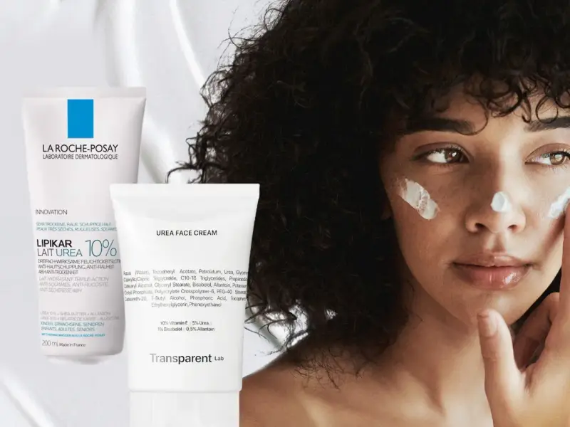 Eine Frau mit lockigem Haar trägt Gesichtscreme auf. Links sind zwei Tuben zu sehen, eine mit "Urea 10%" und eine mit "Urea Face Cream".